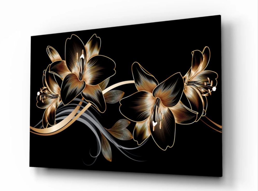 Decorative wall art with gold floral design on a black background