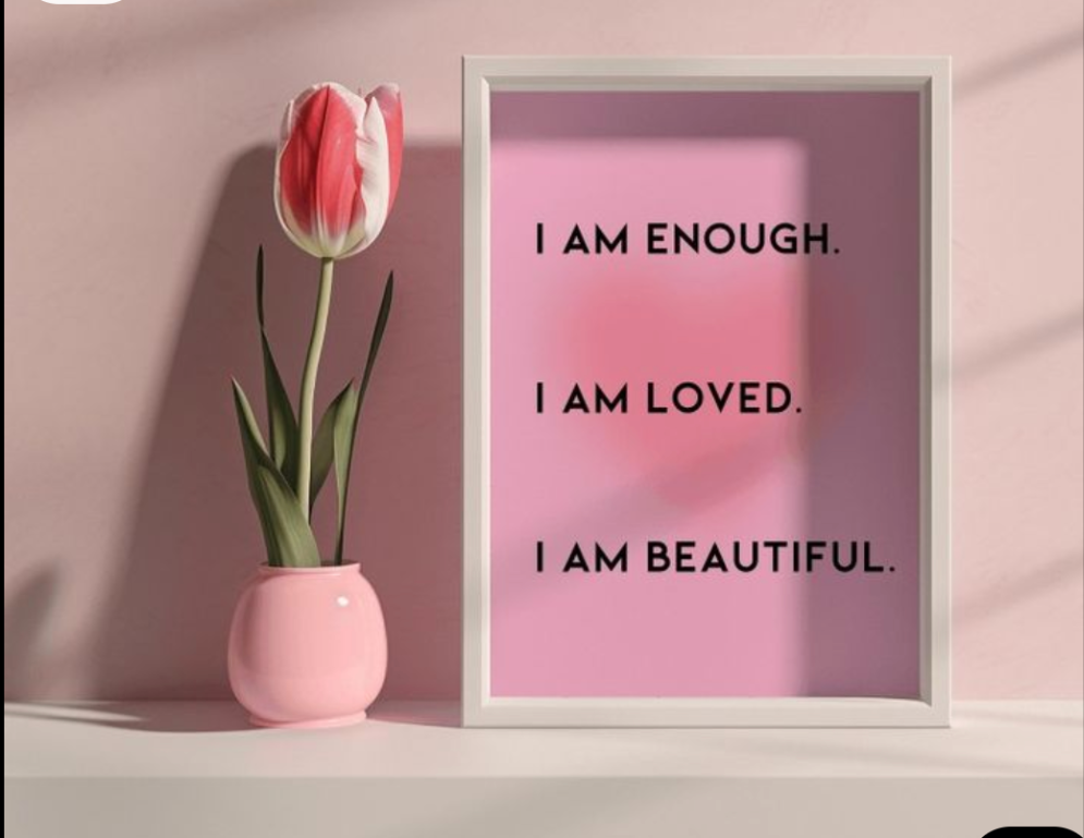 Framed motivational quote with a pink tulip in a pink vase on a light pink background
