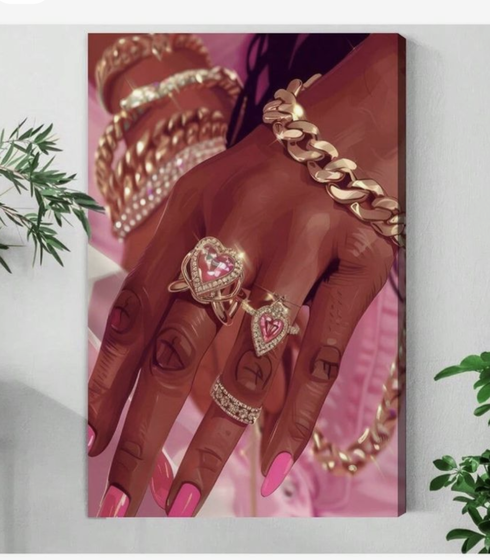 Hand with jewelry on a pink background